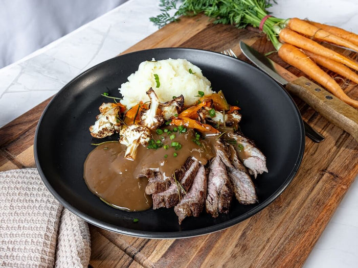 Steak Diane with creamy mash and roasted vegetables