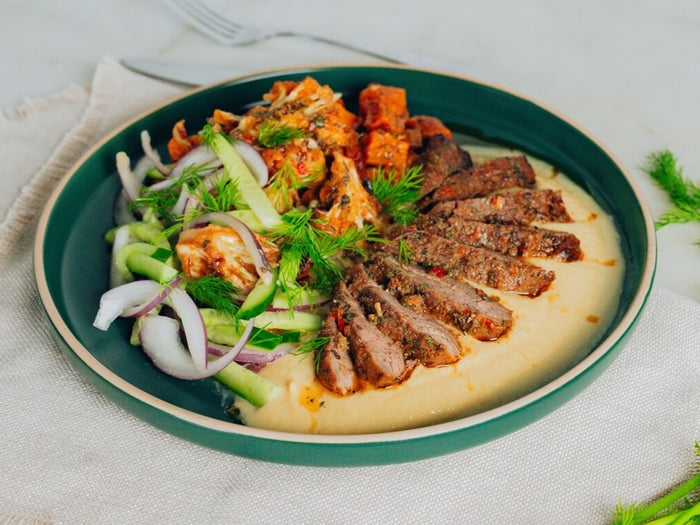 Spiced lamb with tahini sauce, roasted cauliflower and sweet potato
