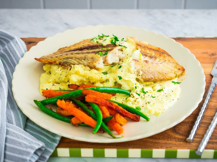 Oven-baked barramundi with creamy leek sauce and mashed potato