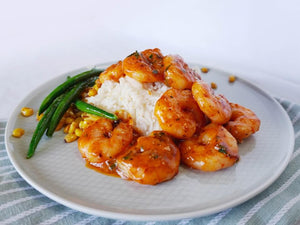 Creamy cajun prawns with garlic butter beans, corn and rice