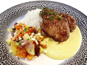 Lamb steak with mustard thyme sauce and roasted vegetables